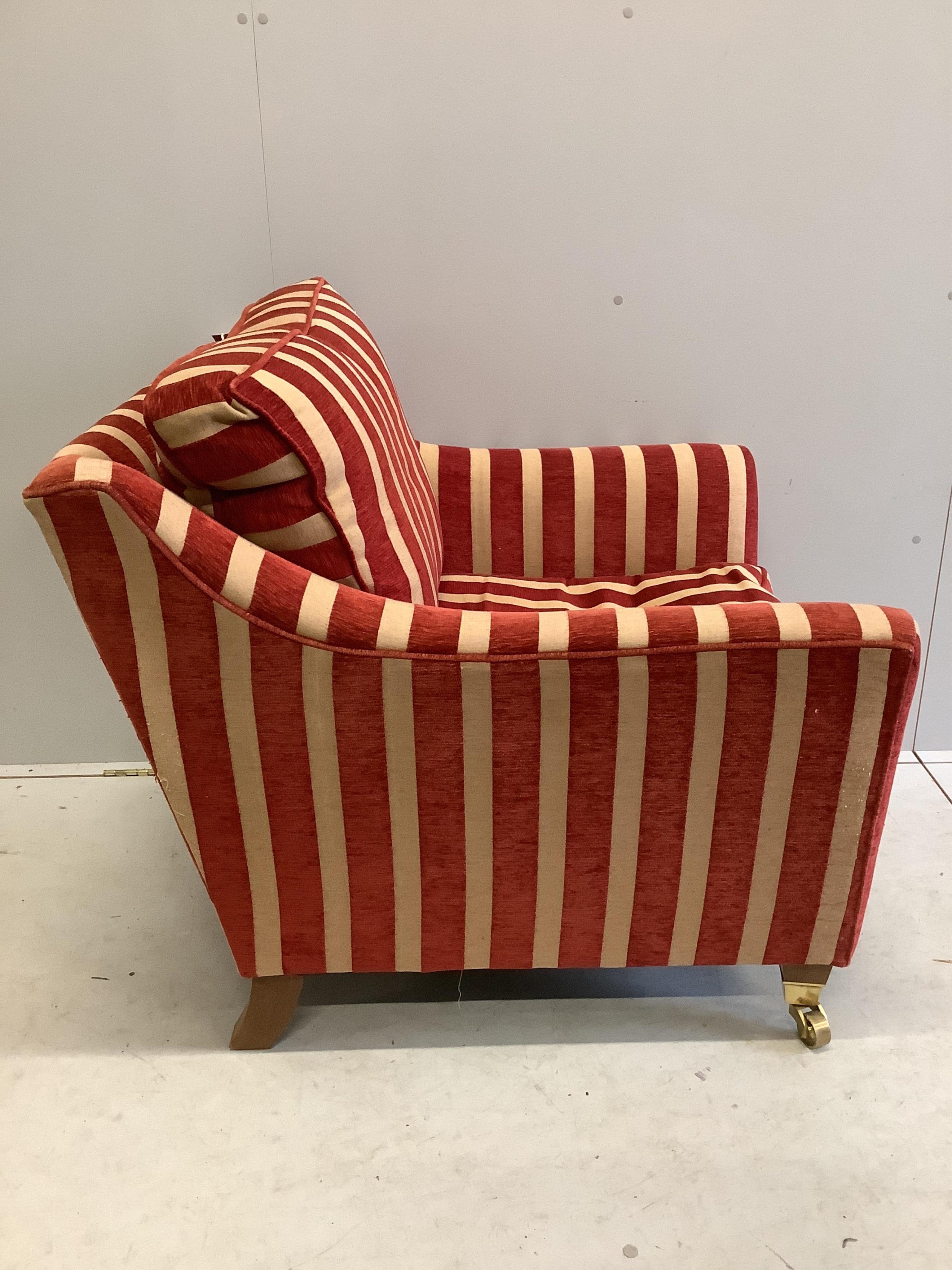 A Contemporary club armchair upholstered in Colefax & Fowler striped fabric, width 88cm, depth 89cm, height 93cm. Condition - fair